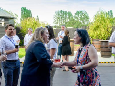 People networking outside in the sunshine at a Logistics event