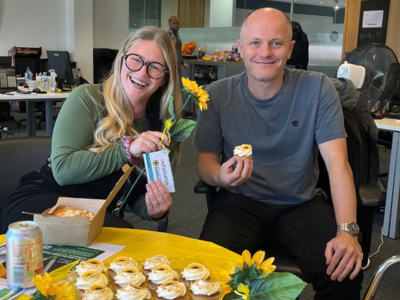 Photo of our Manchester team with Sunflowers and Sunflower Cupcakes to celebrate the launch of the Sunflower.